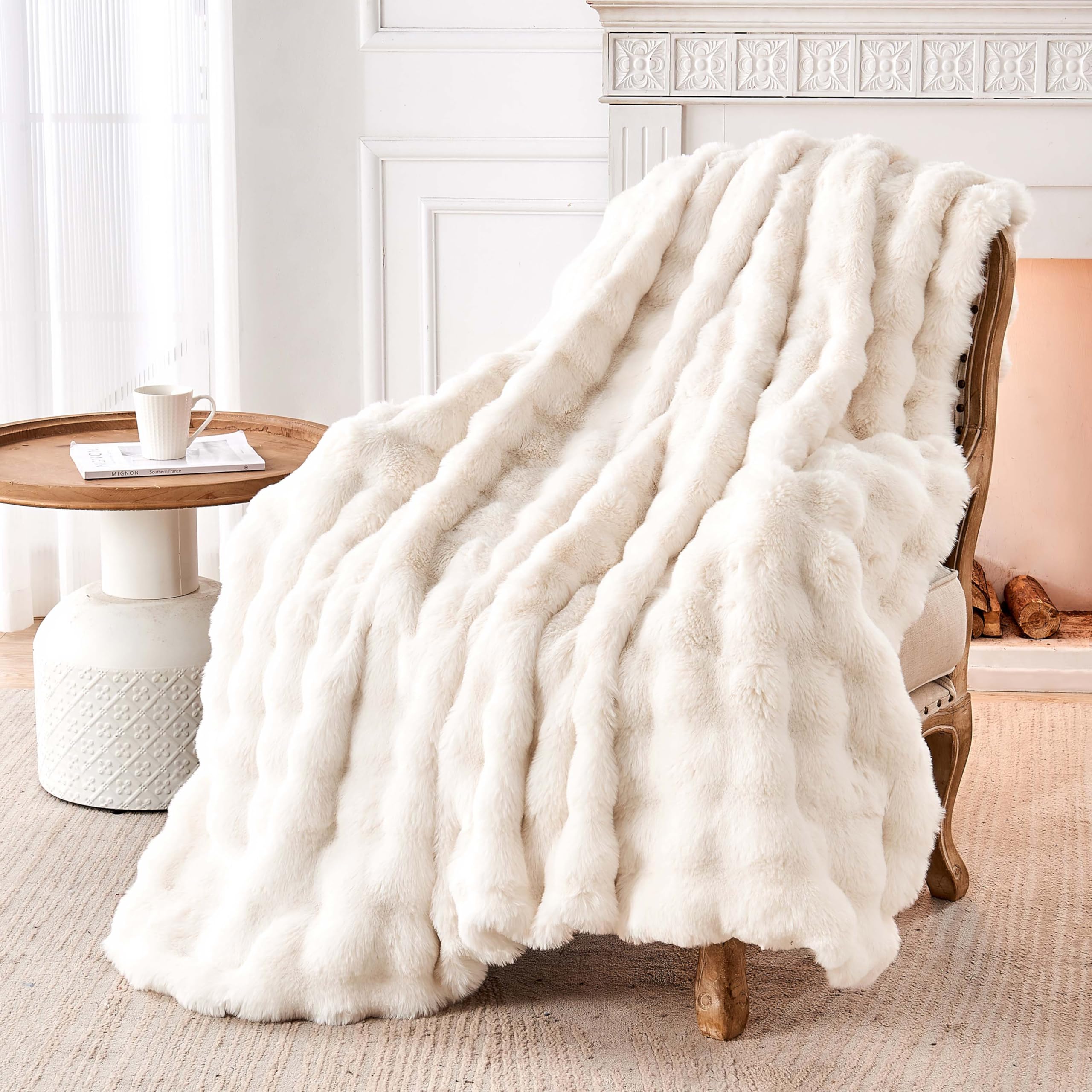 Nobleer throw draped on sofa creating a warm, elegant living room accent