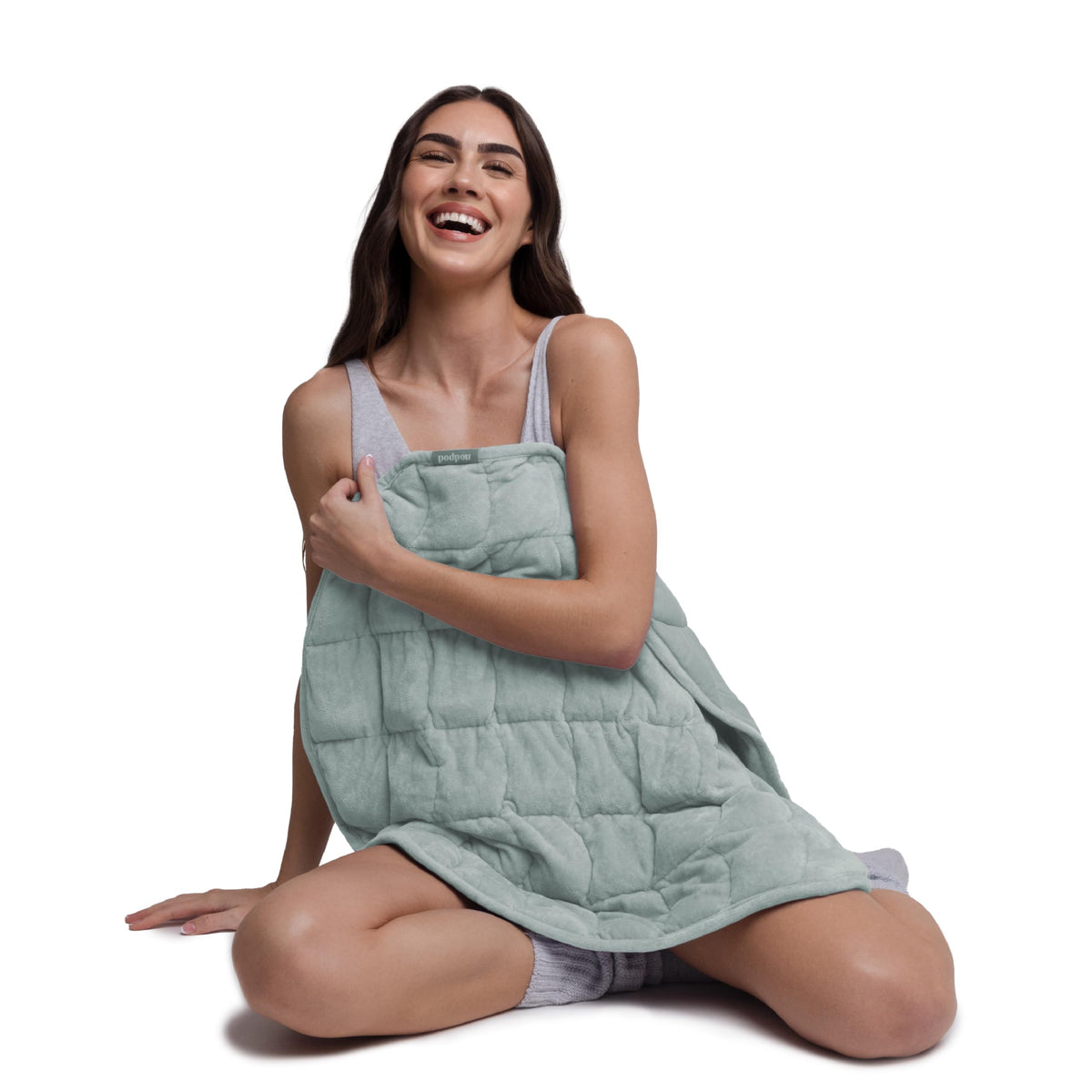 nodpod body front view showing compact weighted blanket and calming design benefits
