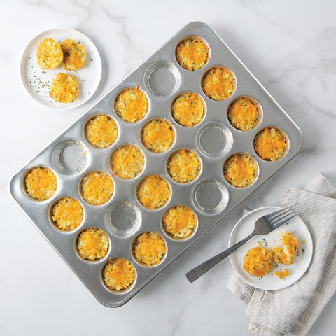 Nordic Ware with baked mini muffins demonstrating even browning and presentation