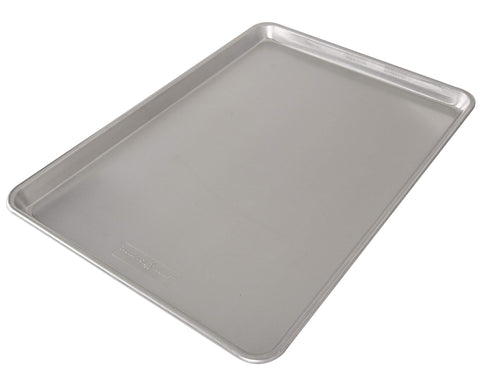 Nordic Ware close-up of aluminum baking surface showing even-heating texture and browning benefit