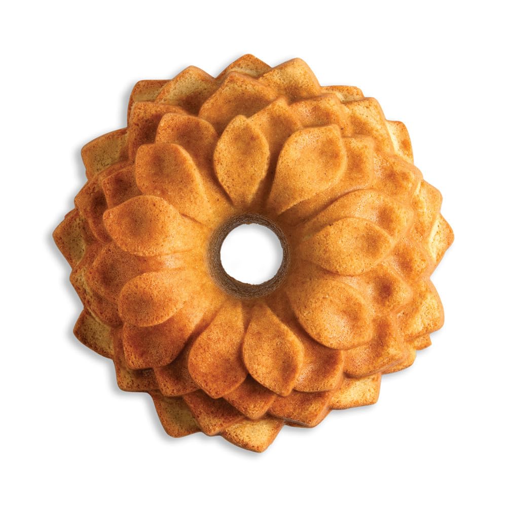 Nordic Ware Blossom Bundt Pan on table with plated slice for serving inspiration
