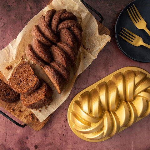 Nordic Ware loaf pan next to ruler showing dimensions and portion control benefit