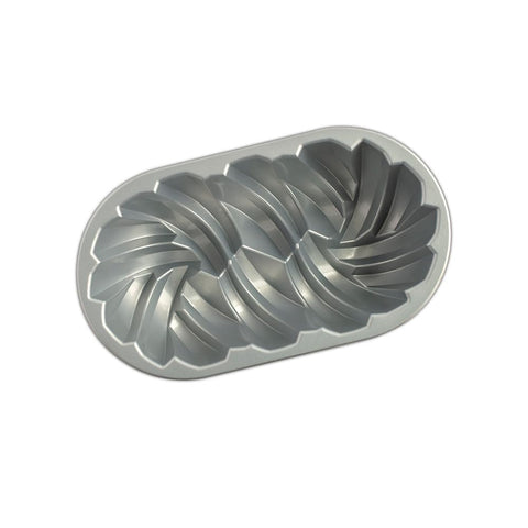 Nordic Ware loaf pan with baked loaf removed illustrating effortless release benefit