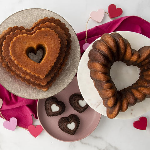 Nordic Ware Elegant Heart Bundt beside measuring cup for scale shows 10-cup capacity clarity