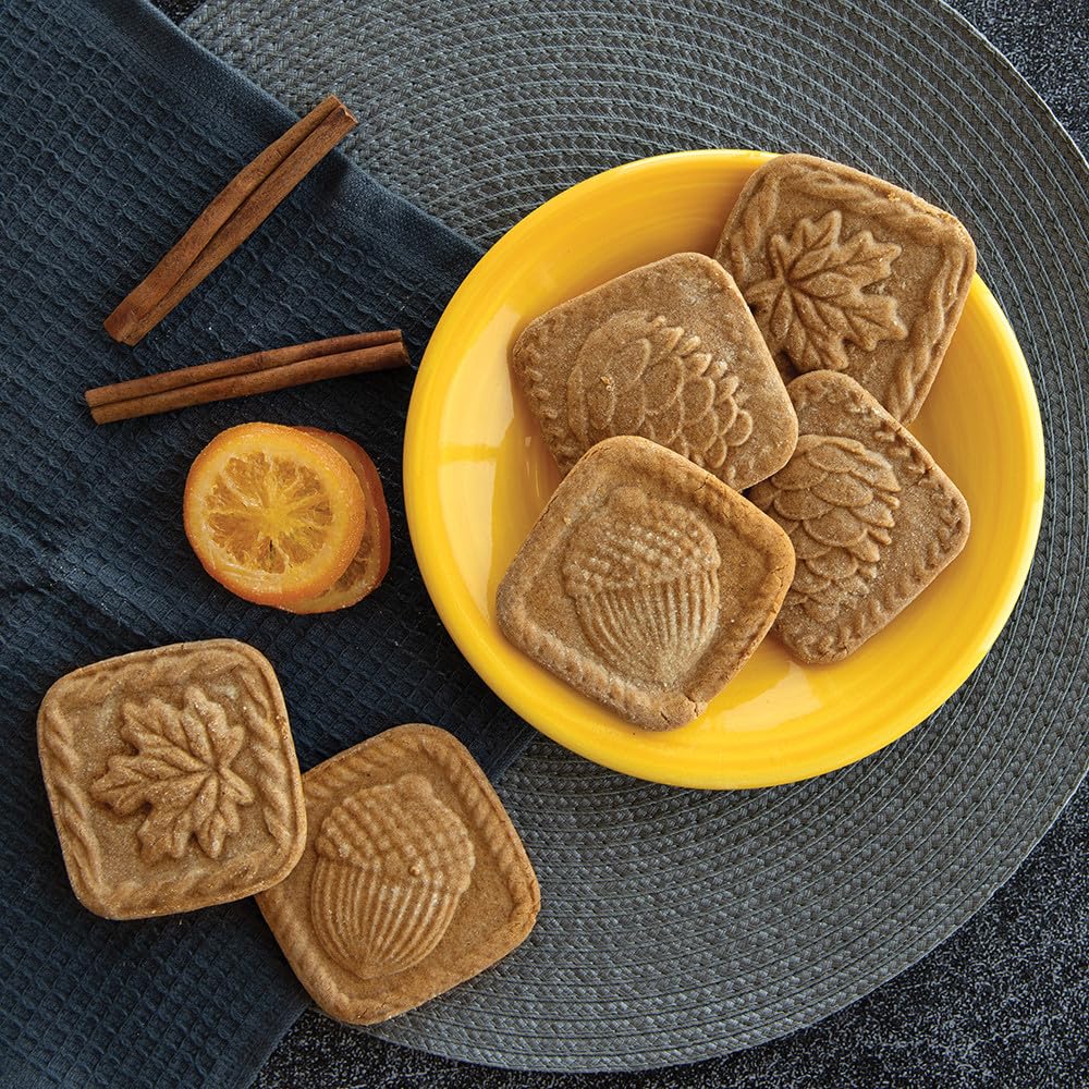 Nordic Ware finished embossed cookies on baking sheet, showcases ornate designs without extra icing