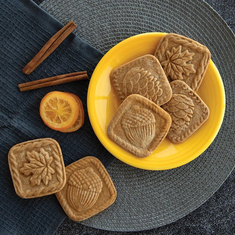 Nordic Ware finished embossed cookies on baking sheet, showcases ornate designs without extra icing