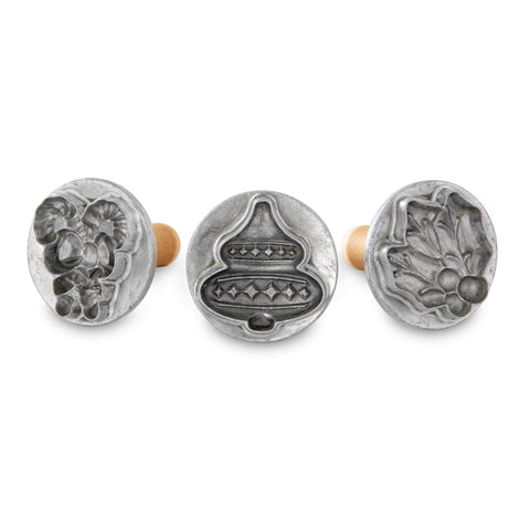 Nordic Ware front view of three cookie stamps showing crisp holiday designs and durable build