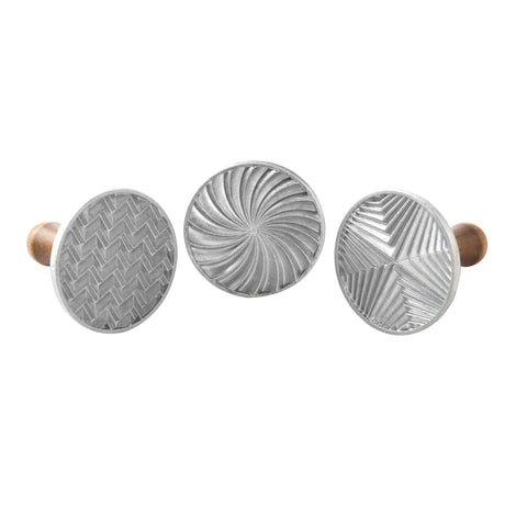 Nordic Ware stamp front view showing three geometric patterns for clean designs
