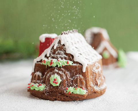 Nordic Ware baked halves being frosted showing easy decoration and assembly