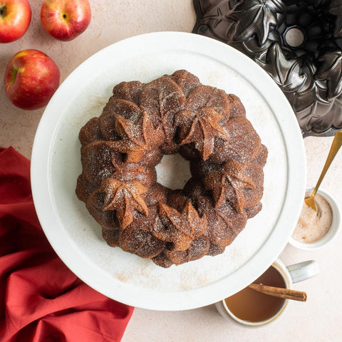 Nordic Ware in-use baked cake unmolded from pan showing sharp leaf design for serving