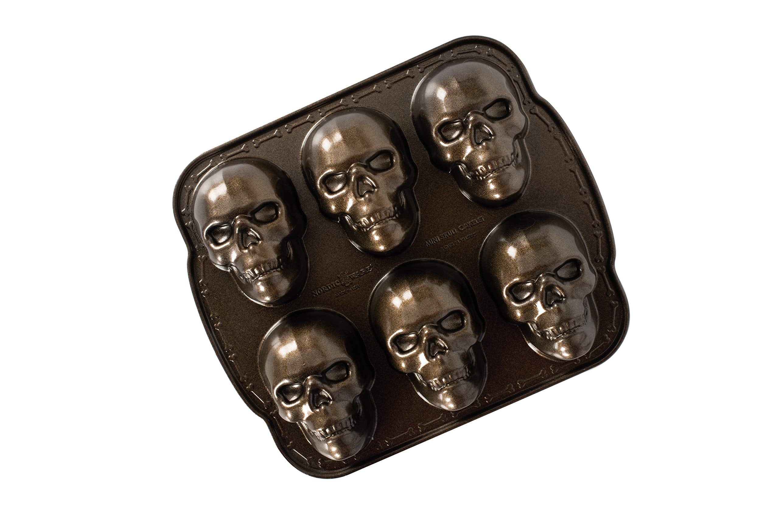 Nordic Ware pan front view showing six skull cavities and bronze finish