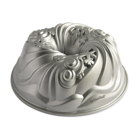 Nordic Ware Let It Snow Bundt front view showing silver finish and decorative appeal