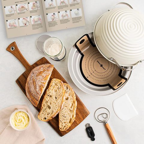 Nordic Ware lid lined with cotton towel proofing dough, showing neat rise and easy transfer