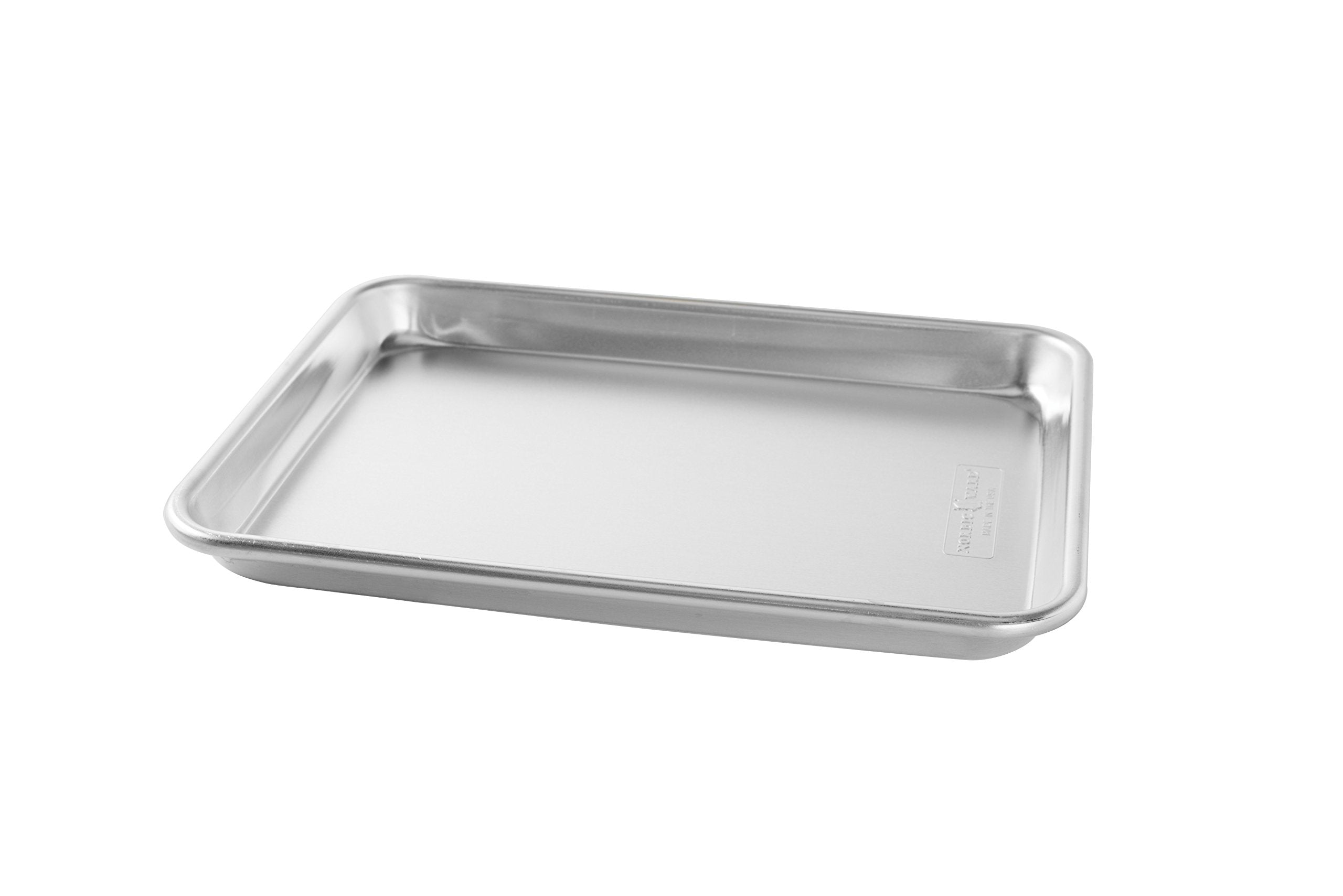 Nordic Ware quarter sheets on counter with baked cookies showing everyday baking utility