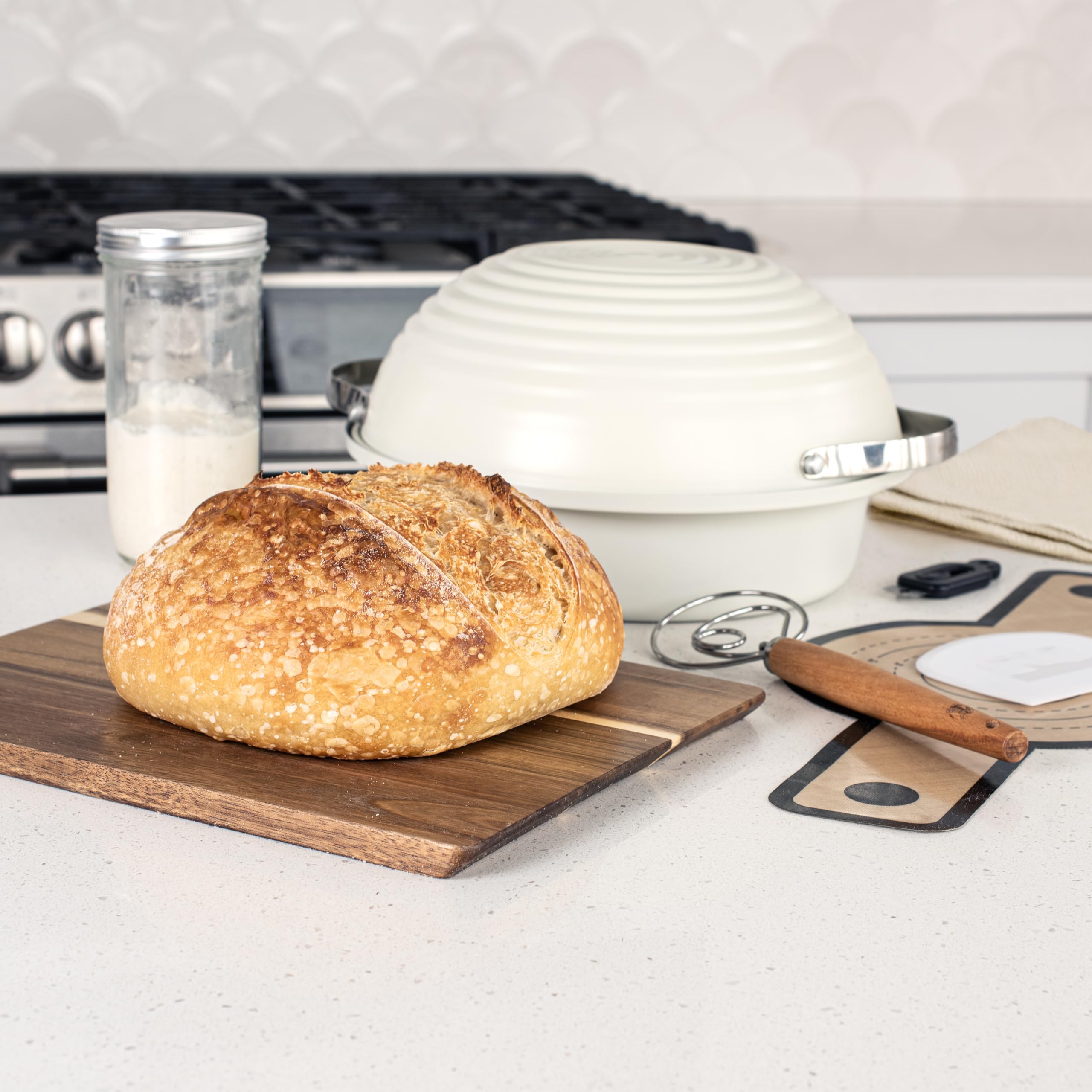 Nordic Ware aluminized steel base with aluminum domed lid demonstrating bake-ready fit and steam retention