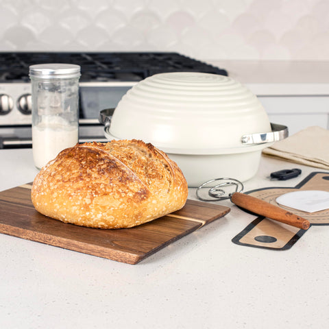 Nordic Ware aluminized steel base with aluminum domed lid demonstrating bake-ready fit and steam retention