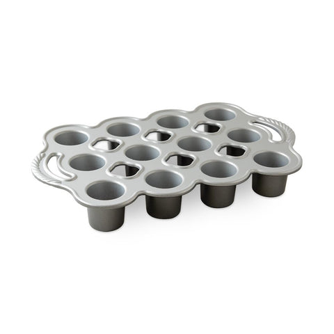 Nordic Ware front view of petite popover pan showing 12 cavities and silver finish for even baking