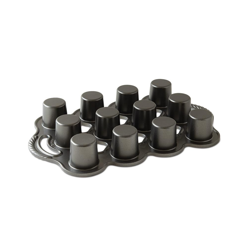 Nordic Ware pan next to measuring cup showing 1/4-cup cavity capacity for consistent portions