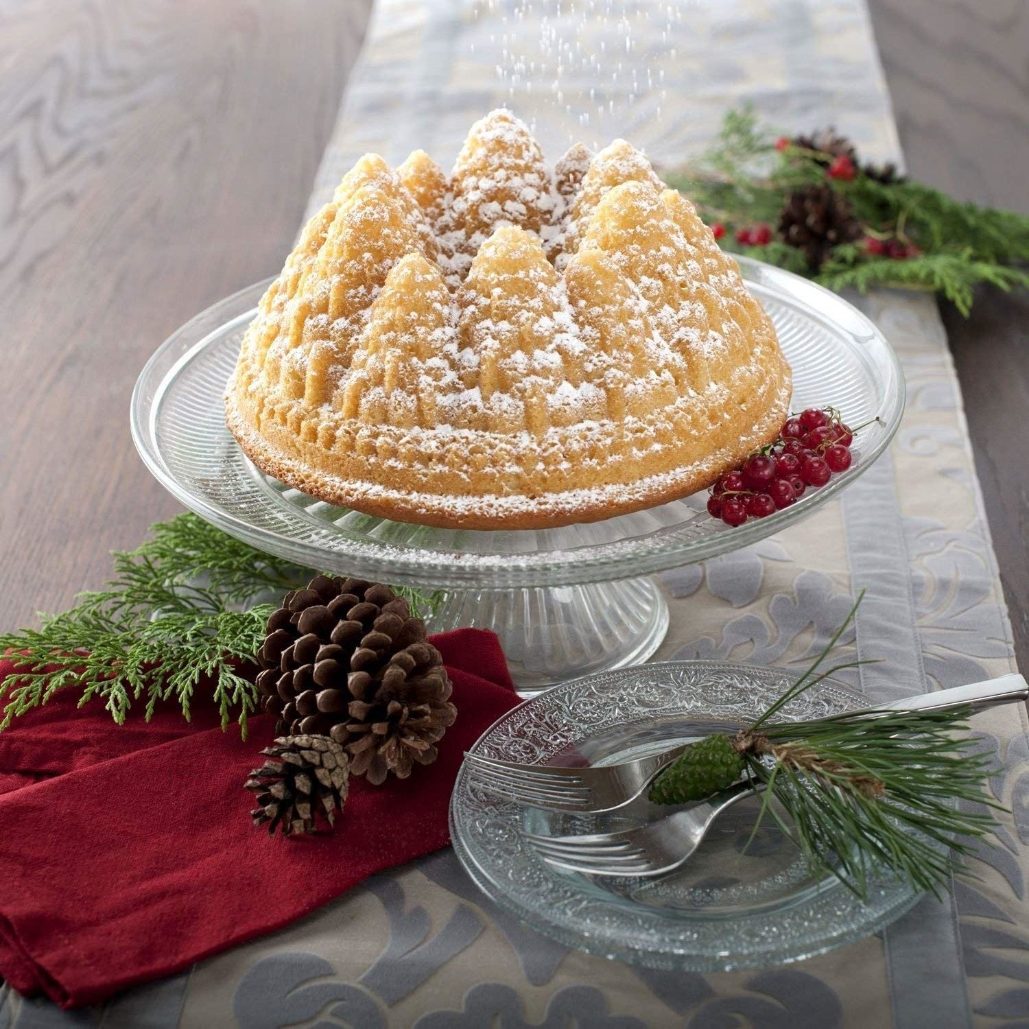 Nordic Ware close-up of Pine Forest pan texture capturing intricate branches and frosting detail