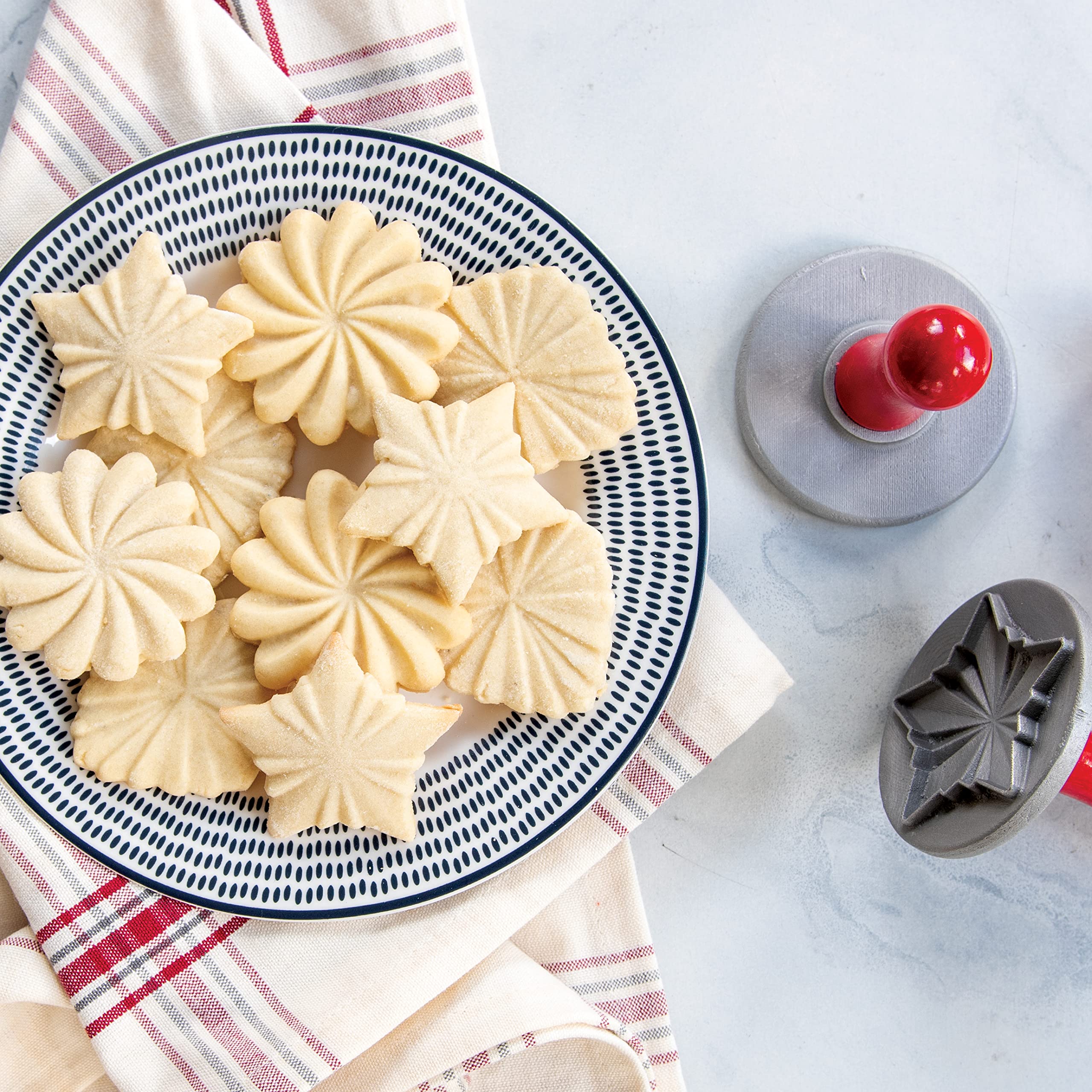 Nordic Ware aluminum stamp detail showing intricate pleated relief, creating crisp cookie impressions