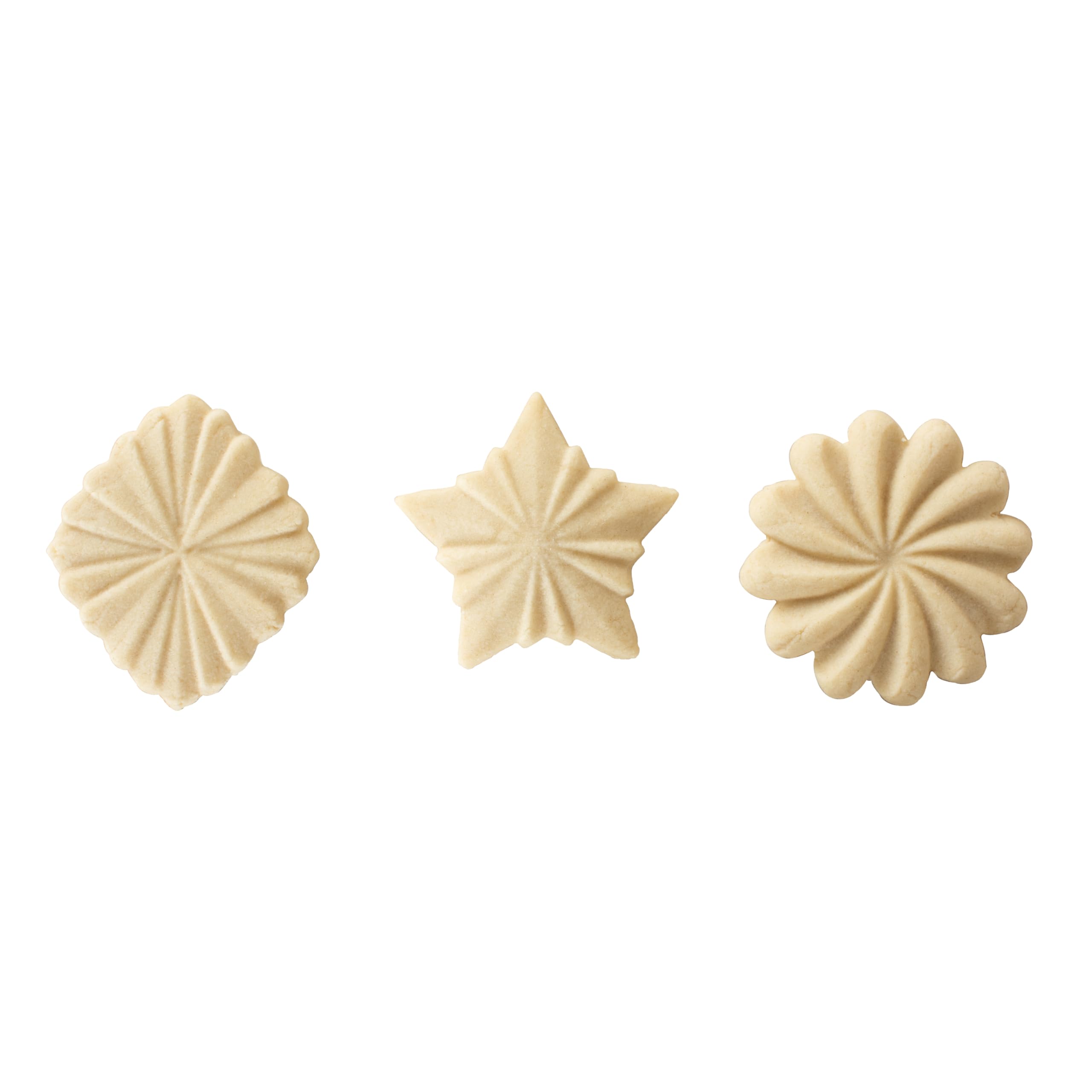 Nordic Ware set pressing stamp into chilled cookie dough, demonstrating simple in-kitchen use for neat patterns