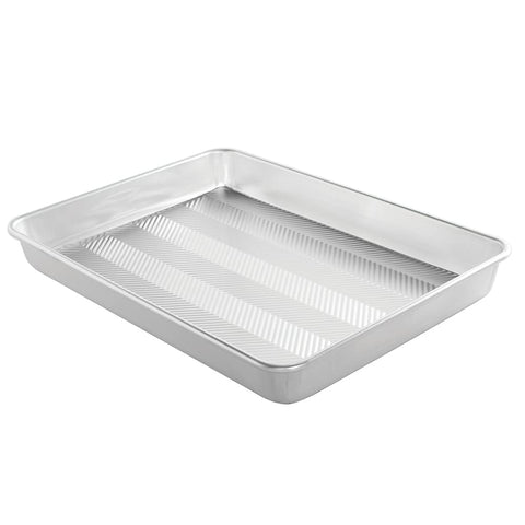 Nordic Ware front view of high-sided sheet pan showing size and sturdy rims for reliable baking