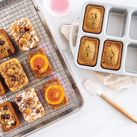 Nordic Ware Procast with freshly baked mini loaves demonstrating even browning
