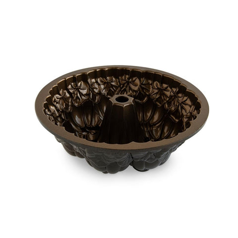 Nordic Ware pumpkin Bundt cake on autumn table setting for seasonal presentation
