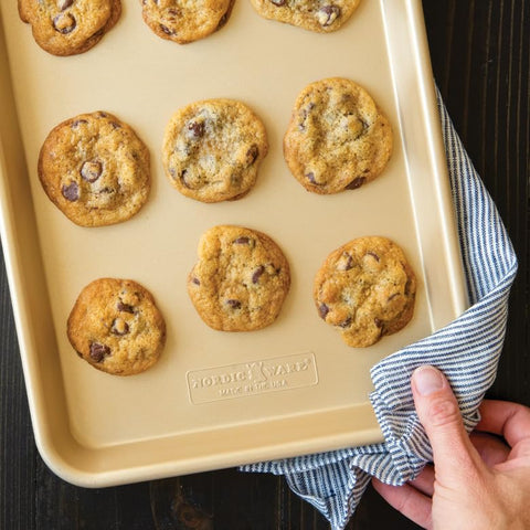 Nordic Ware pans in oven with baked cookies for consistent browning