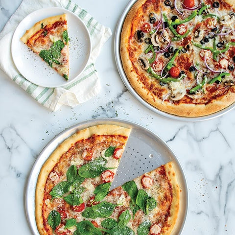 Nordic Ware pan beside ruler showing 16-inch diameter and fit for large pizzas