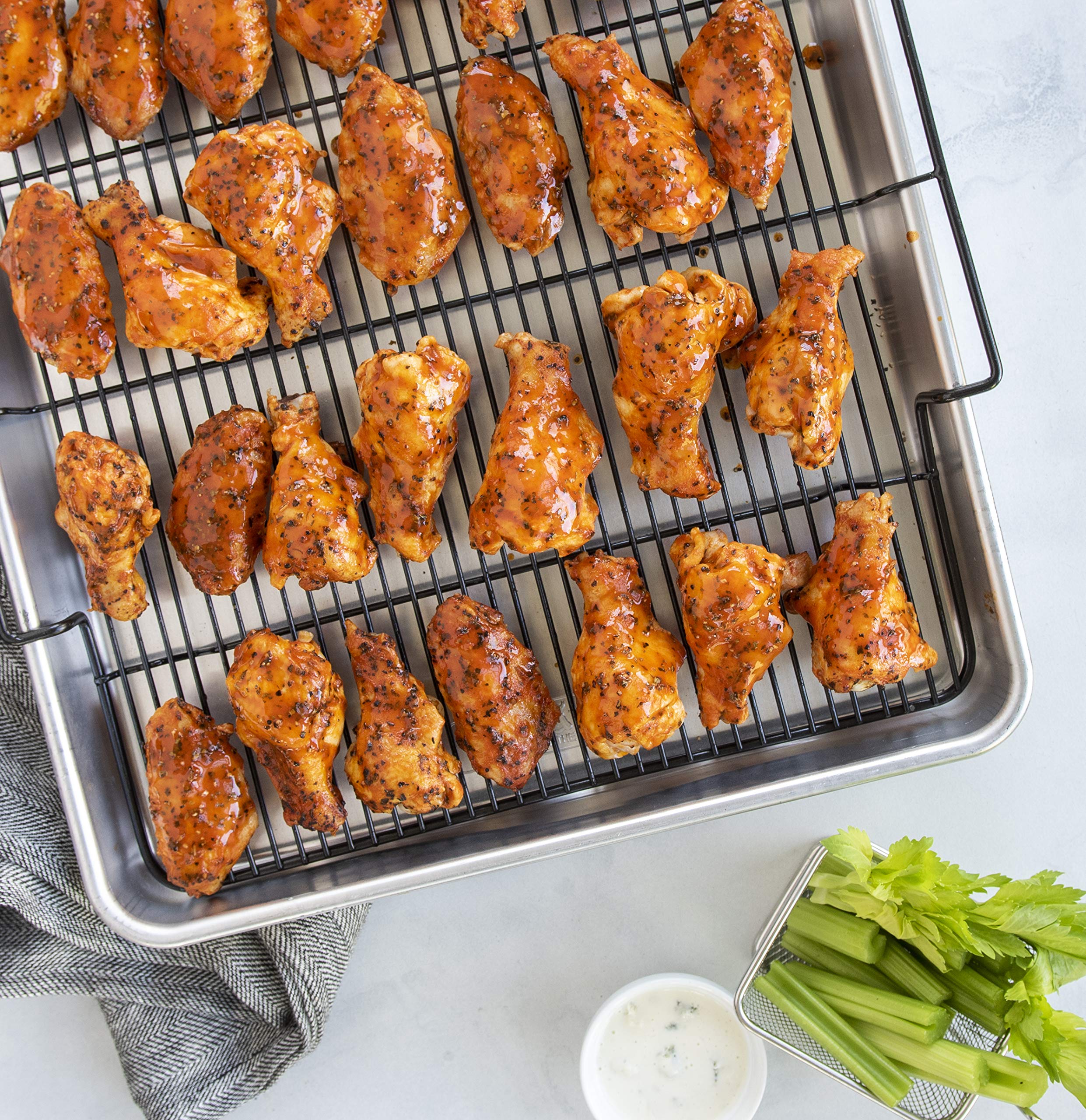 Nordic Ware next to standard sheet pan showing extra capacity benefit