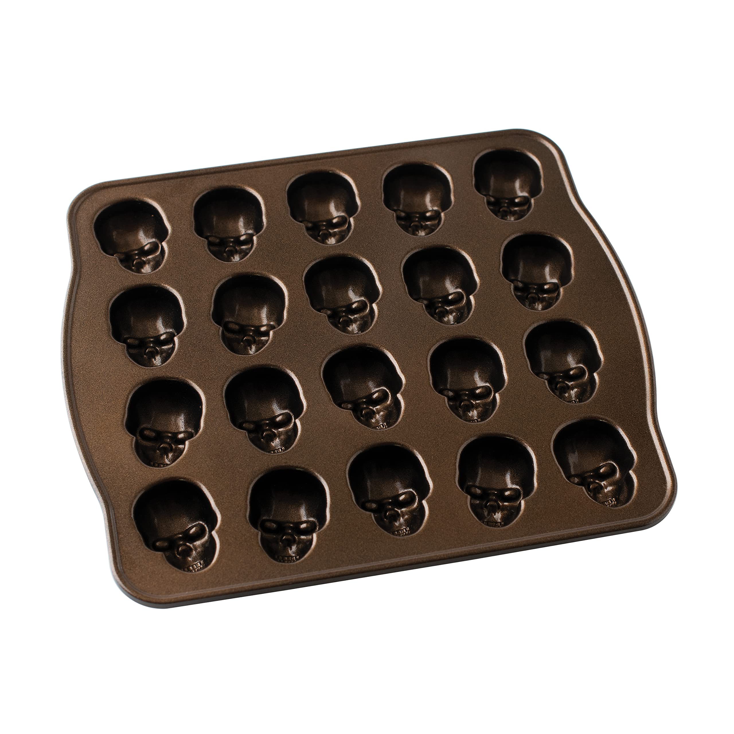 Nordic Ware pan in use as batter is poured into skull cavities for consistent fills