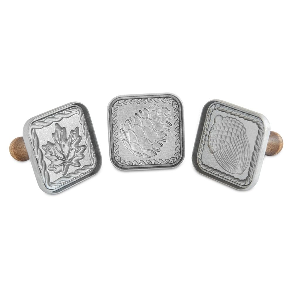 Nordic Ware front view of three cast aluminum cookie stamps showing designs and handles, durable embossing