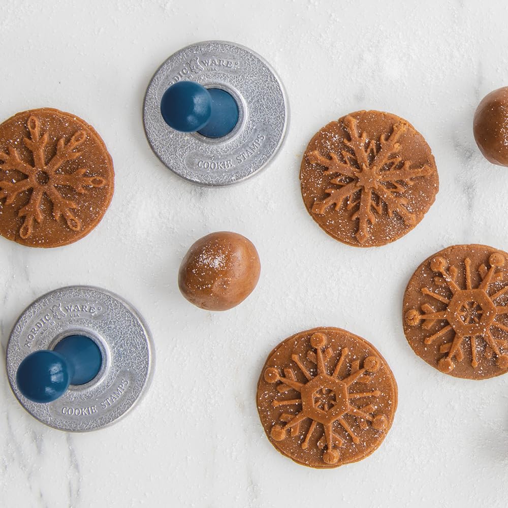 Nordic Ware pressing stamp into cold dough illustrating easy embossing benefit