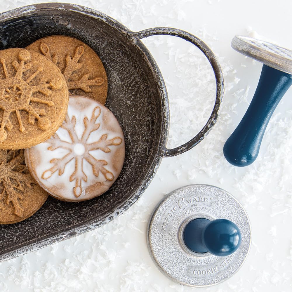 Nordic Ware stamps dusted with flour demonstrating anti-stick preparation tip