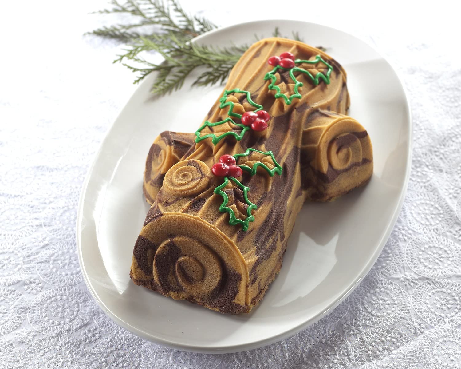 Nordic Ware pan on kitchen counter with finished cake illustrating holiday centerpiece convenience