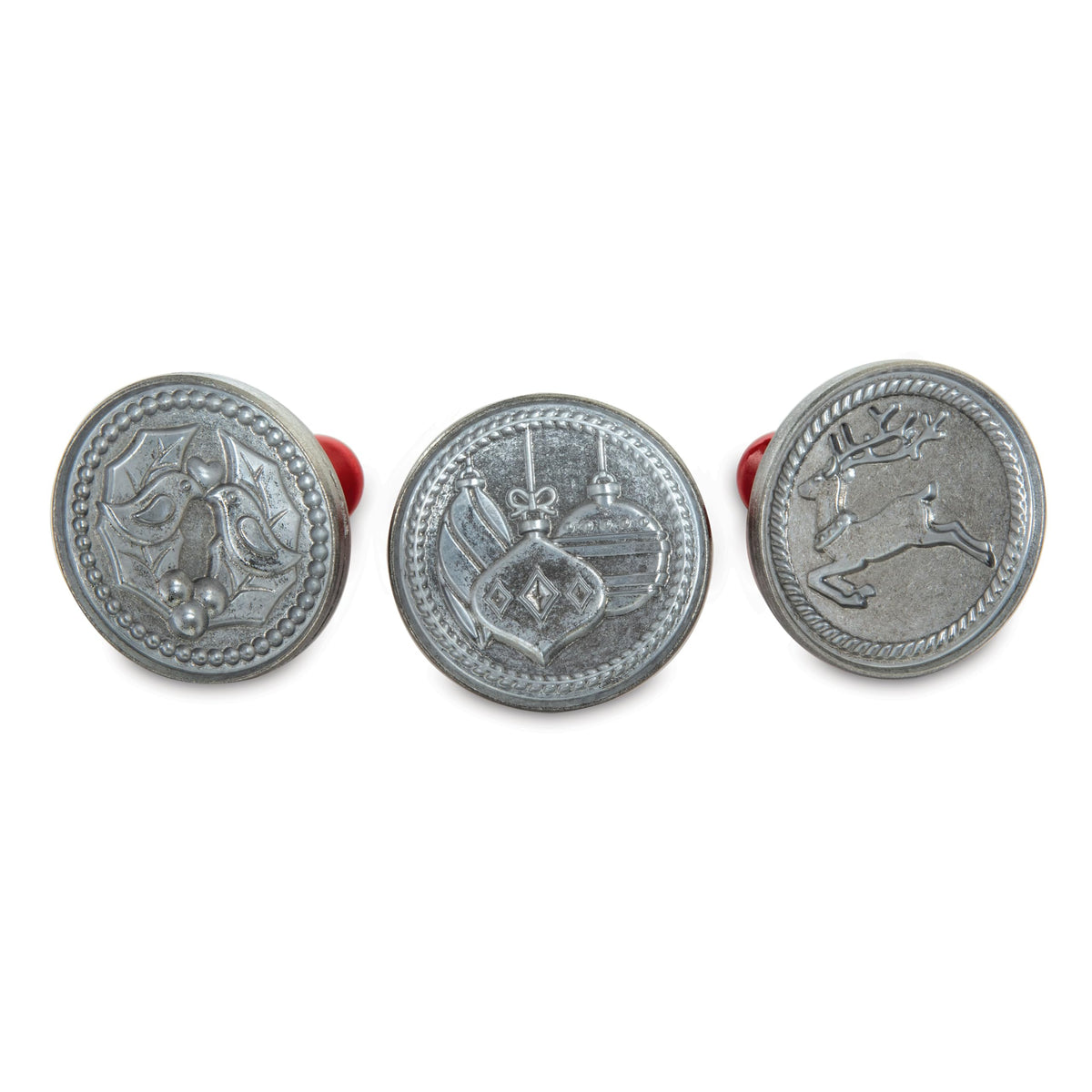 Nordic Ware front view of three cookie stamps showing festive designs and durable build