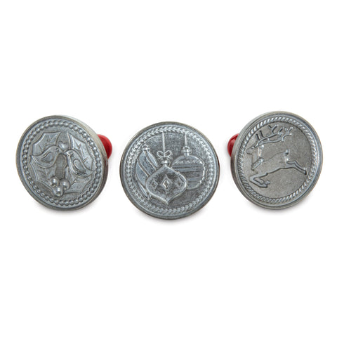 Nordic Ware front view of three cookie stamps showing festive designs and durable build