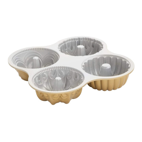 Nordic Ware front view of quartet pans showing gold finish and shapes, showcasing versatility
