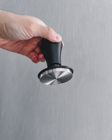 Normcore tamper staged on countertop showing café-ready durability benefit