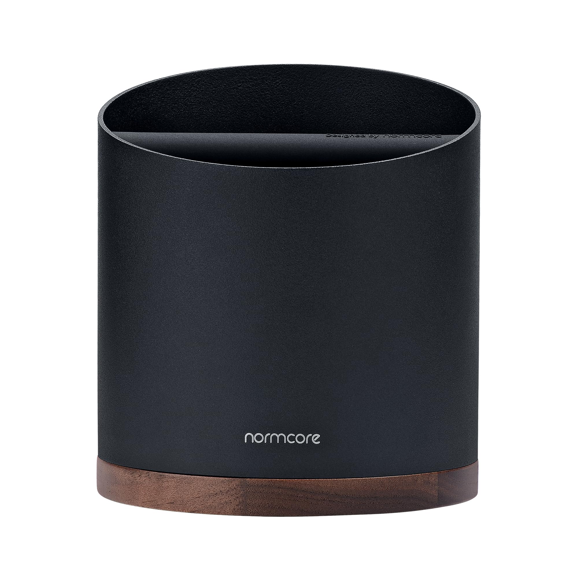 Normcore close-up of walnut base with rubber pads providing stability and counter protection