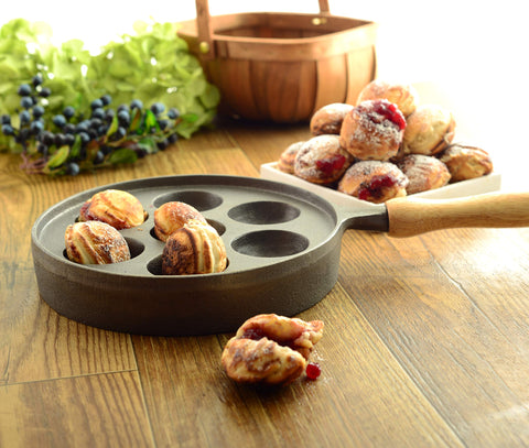 Norpro pan next to utensils demonstrating compact size and countertop fit