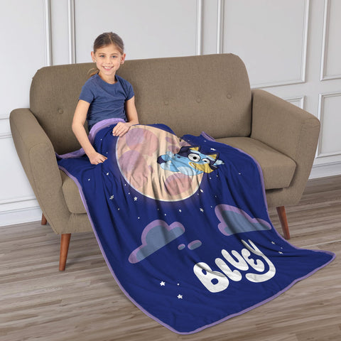 Northwest Bluey throw beside a ruler showing 46 by 60 inch scale