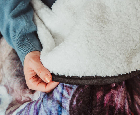 Northwest Harry Potter throw layered on bed demonstrating stylish bedding accent and warmth