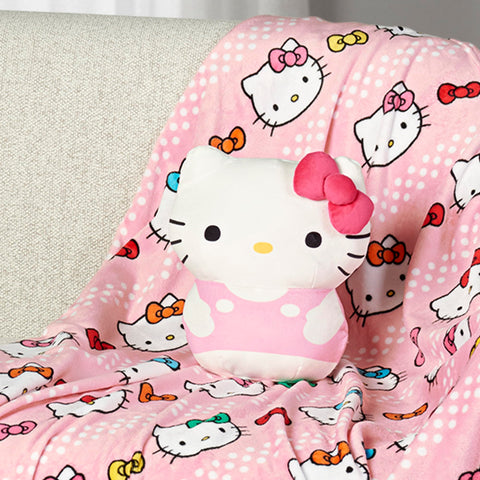 Northwest Hello Kitty blanket pattern close-up showing silky texture and colorful bows