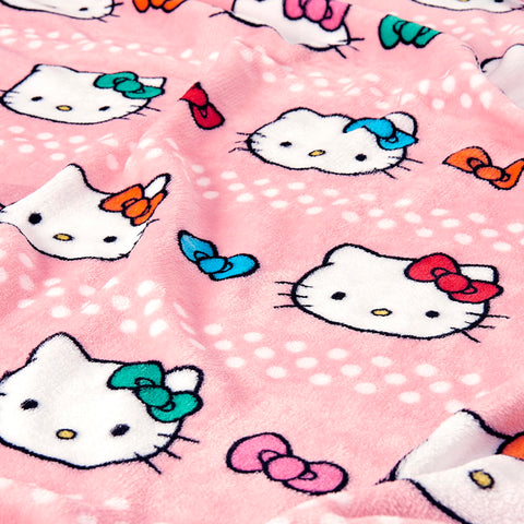 Northwest Hello Kitty hugger next to ruler showing 11-inch size and travel portability