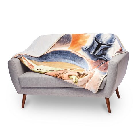 Northwest Mandalorian throw on sofa lifestyle scene adding fandom style and cozy comfort