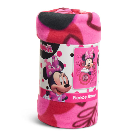 Northwest Minnie Mouse blanket layered on bed for extra warmth and style