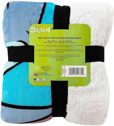 Northwest blanket folded next to ruler showing 60x80 scale and generous coverage