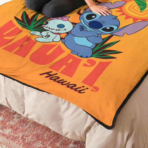 Northwest Stitch throw draped on couch showing cozy use and decorative impact
